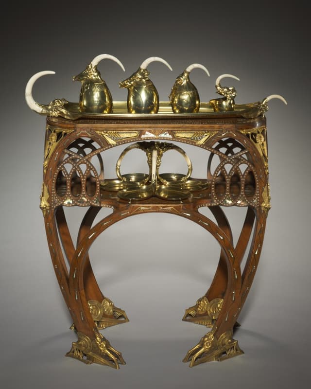 Bugatti's tea table. Vellum, copper, pewter. I don't like it. I keep looking at it. That's design.
