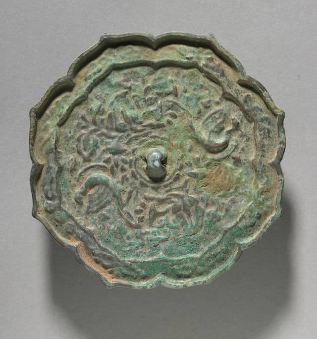 Bronze mirror, 1100s. The back is the design; the front is the function. They kept them separate. We should.