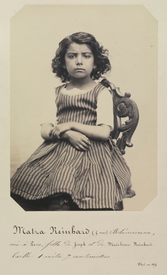 A photograph of a shop front, 1868, as a type specimen. The sign is the font. Shoot signs, not specimens.
