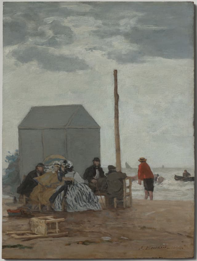 Deauville. Everyone in black on the sand. A group shot that isn't posed. That's the brief for every campaign.